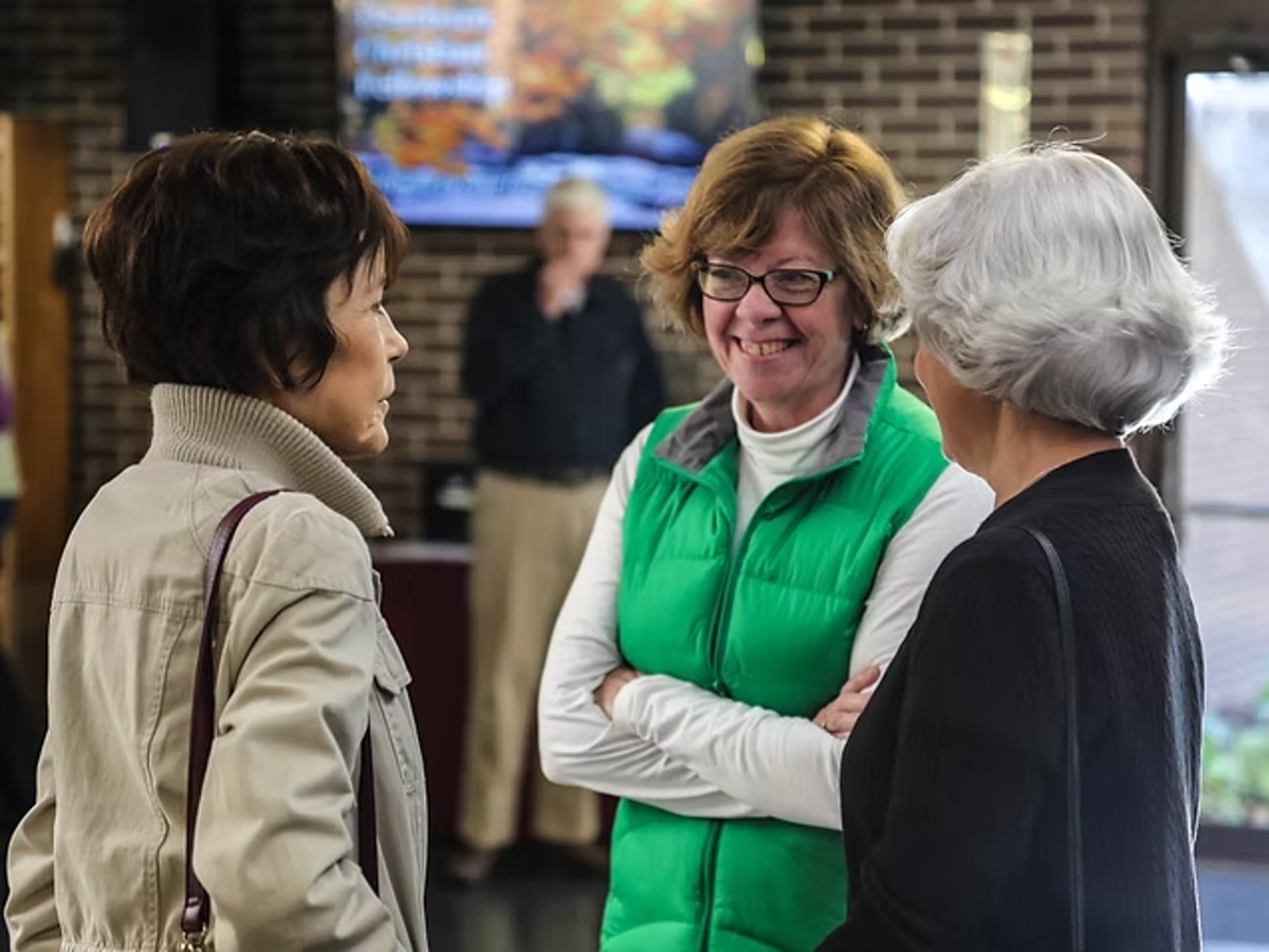 Members talking together in the lobby after a Sunday service at Dearborn Christian Fellowship